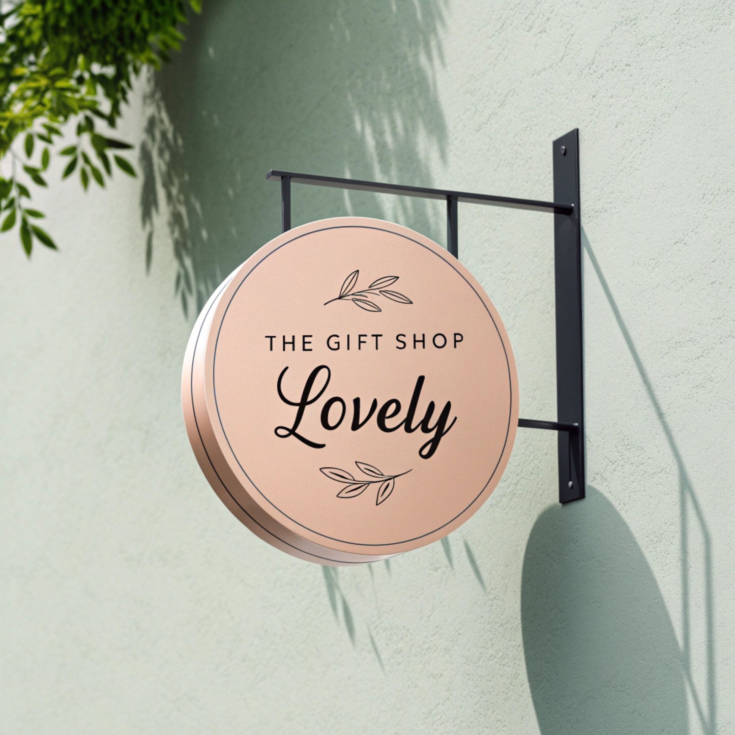 Round sign for 'The Gift Shop Lovely' 

