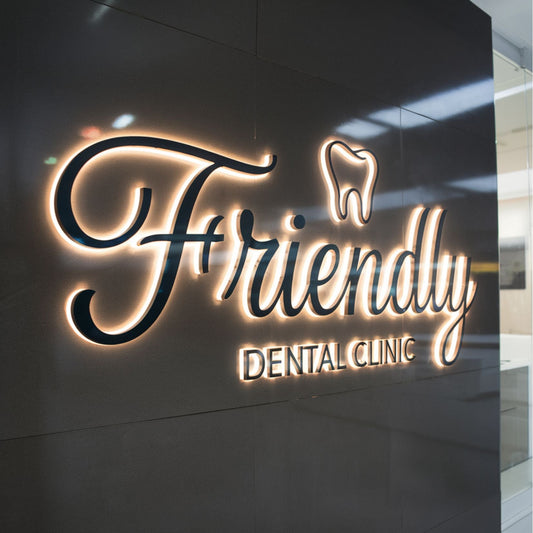 Front view of Friendly Dental Clinic 3D backlit metal sign